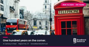 Red telephone box with an illuminated TELEPHONE sign and embossed crown on a busy London street, with a number 26 double decker bus, taxis and a white church spire behind; a navy caption bar reads one hundred years on the corner, A Century in Red, Report 