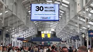 Airport terminal with screen showing Bluetail logo and 30 million records digitized.