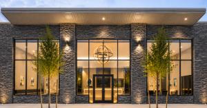 Front entrance of Discovery School of Innovation’s new six-acre campus in the Greater Woodlands area at dusk
