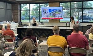 Worthington project developer speaking with homeowners during a remodeling seminar at the Carmel showroom