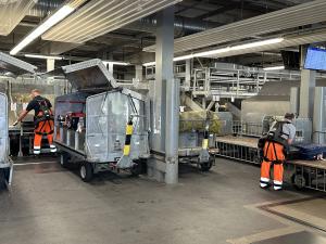 Human-centric robotics at Nuremberg Airport: AI-powered exoskeletons support baggage handlers in physically demanding lifting and moving tasks.