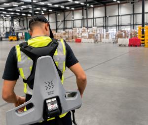 Air cargo operations at Maastricht Aachen Airport: A worker wearing German Bionic’s AI-powered EXIA exoskeleton while handling cargo.
