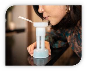 A Woman Self-Administering the Oro Lesion Test