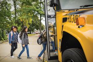Kids boarding a propane school bus