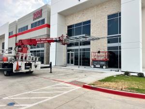 Royal Signs & Awnings installing Metal Canopy for IDI