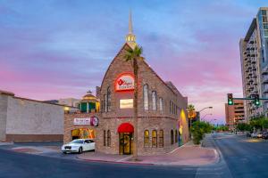 A brick two-story Las Vegas wedding chapel with a drive thru and a rooftop gazebo