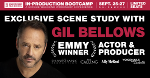 Gil Bellows sits across from an acting participant during a Scene Study workshop, discussing performance in a VFS studio.