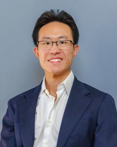 Leighton Tyau, Founder and Principal Attorney at Copper State Planning, wearing a navy blue blazer and white shirt.
