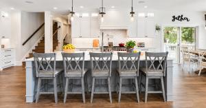 Modern custom kitchen remodel with white cabinetry, quartz countertops, and a large island in an Orlando, Florida home by I-4 Kitchen and Bath.