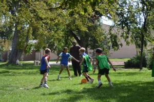 Kids playing soccer and testing out their worldie multisport shoes for the first time