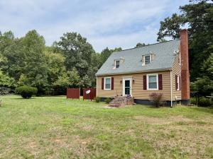 3 BR/1.5 BA Cape Cod-style home w/walk-out basement on 2.15 +/- acres minutes from historic downtown Gordonsville, VA (Louisa County) •	The home measures 2,479 +/- gross sf. and features one bedroom and half bath on the main level and 2 bedrooms