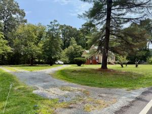 3 BR/1.5 BA Cape Cod-style home w/walk-out basement on 2.15 +/- acres minutes from historic downtown Gordonsville, VA (Louisa County) •	The home measures 2,479 +/- gross sf. and features one bedroom and half bath on the main level and 2 bedrooms
