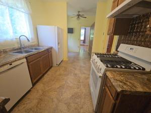 3 BR/1.5 BA Cape Cod-style home w/walk-out basement on 2.15 +/- acres minutes from historic downtown Gordonsville, VA (Louisa County) •	The home measures 2,479 +/- gross sf. and features one bedroom and half bath on the main level and 2 bedrooms