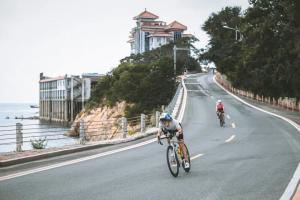 Cyclists racing on the coastal course in Weihai