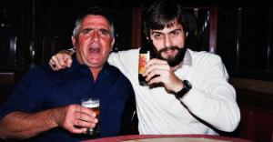 Paul Rushworth-Brown sharing a drink with his father, Jimmy Brown, in a candid father-and-son photograph.