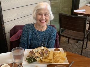 Dolly, Lyle's Mom, enjoying a meal a restaurant on her birthday, days before the fall that broke her hip and her will to live.