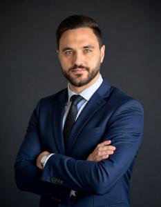 Professional portrait of Mustafa Nejem, Master Mariner and maritime sustainability leader.