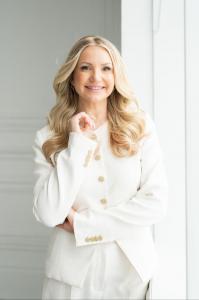 Irina Posan wearing a white suit, author of The Career you Crave