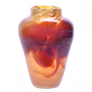 Paperweight vase signed “L.C.T.” (Louis Comfort Tiffany), translucent iridescent gold with red and opal mottled highlights, 8¼ inches tall and weighing 2.6 pounds. Sold for $11,500.