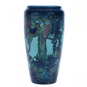 This gorgeous Rookwood art pottery vase dated 1922, model #1369B, 14¾ inches tall with a blue matte jungle design and artist signed Edward T. Hurley, changed hands for $8,625.