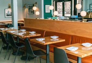 Dining room interior at The Greenwich restaurant in Denver after a same-day painting project by Harmony Painting