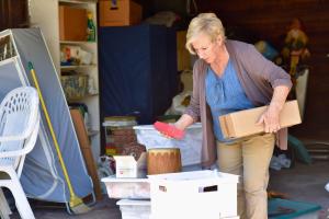 Homeowner sorting belongings while preparing to sell a house as-is in Chicagoland