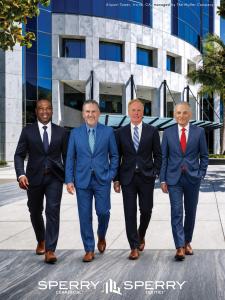 CFO Cornelius Mendez, CEO Burton Young, President Jack Carroll, and Chairman Rand Sperry in front of the Airport Tower in Irvine, CA, where Sperry Equities and Sperry Commercial are based.