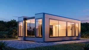 Pulse Container expandable pod fully deployed and glazed with interior lighting at dusk | The Clear Idea