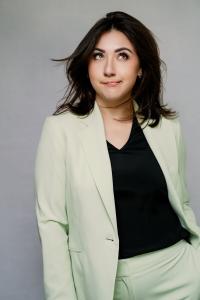 Half body shot of a woman in suit