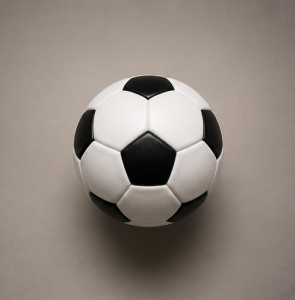 A traditional soccer ball mounted on the wall with the Invisi-ball Mount. The mount disappears behind the ball and is not seen.