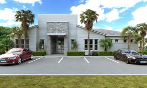 Rendering of a single-story clubhouse with a stone-clad entry tower, white siding, palms, and parking.