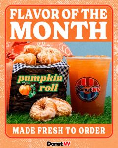 Promotional photo for DonutNV’s Flavor of the Month: a woven basket lined with a blue-and-white checkered napkin holds glazed mini donuts topped with crumb, with more donuts resting on green grass in front. An orange drink in a clear cup with the DonutNV