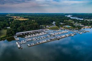 Aerial view of Skipjack Cove Marina in Georgetown, Maryland, featuring wet slips, covered boat storage and waterfront facilities along the Sassafras River.
