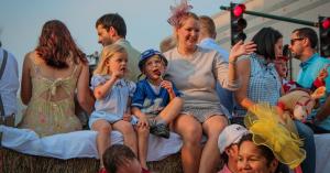 A family participating in the 2025 Childrens parade riding on a float.