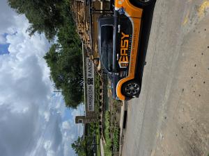 Orange Easy Garage Door Repair van for 24/7 garage door repair in Houston, Texas.
