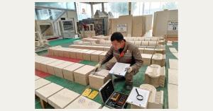 William Jiang reviewing architectural stone quality records