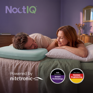 A couple resting peacefully together in bed, featuring the NoctIQ AI-Powered Anti-Snore System with Powered by Nitetronic branding highlighting 4th-generation smart technology.