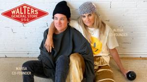 Walters General Store co-founders Alissa Walters and Marisa Luque seated together in front of a white brick wall with the Walters General Store logo.