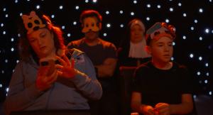Official still from award-winning short film SANDWICHED, pictured: Tiffany Chandon sitting in a theater audience