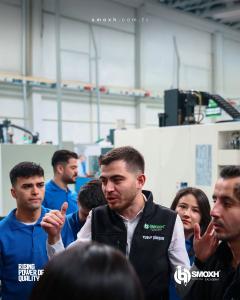 Group of participants during a SMOXH Academy technical session in the company production hall