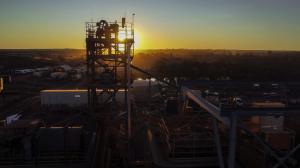 Mine processing plant with sunset in the background