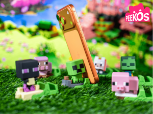 Peekos logo above a range of Minecraft licensed mobile accessories and phone grips displayed with smartphones.