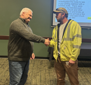 Photo of ChuckKendall on the right, receiving the award from Troy Anderson, left.