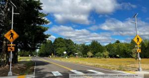 Pedestrian crossing in Newberg, Oregon, with enhanced warning equipment and roadway markings.