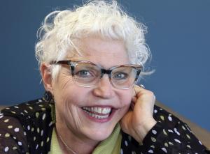 Headshot of author and systems-change practitioner Kathy Coffey Solberg