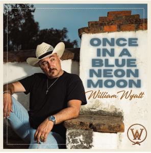 William Wyatt in cowboy hat sitting on adobe bench at night, "Once in a Blue Neon Moon" in block text on wall behind him