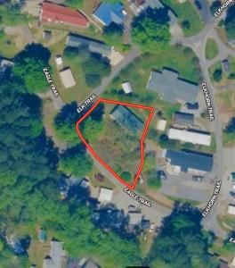 Situated on two lots (E58 & E59) totaling approximately 0.30 acres, this 1,196 +/ sf. doublewide offers a spacious floor plan featuring a large family room, 3 bedrooms, including a generous primary suite with private bath, heat pump for heating/cooling