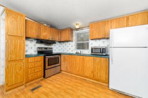 Situated on two lots (E58 & E59) totaling approximately 0.30 acres, this 1,196 +/ sf. doublewide offers a spacious floor plan featuring a large family room, 3 bedrooms, including a generous primary suite with private bath, heat pump for heating/cooling