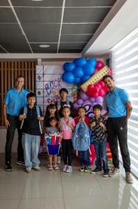 Children with their new backpacks and school suppplies at the Foundation event in Cancun