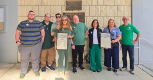 Group of DM advocates in Gainesville, Florida with a DM Awareness Day proclamation.